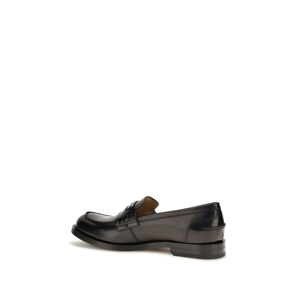 Loafer Slip-On Strap Shoes by Fendi for men in bos taurus calfskin leather & palladium black & palladium showcases a timeless silhouette from the College Men's Bos Taurus Calfskin Leather & Palladium Loafer Slip-On Strap Shoes collection, featuring a timeless and for a timeless finish.
