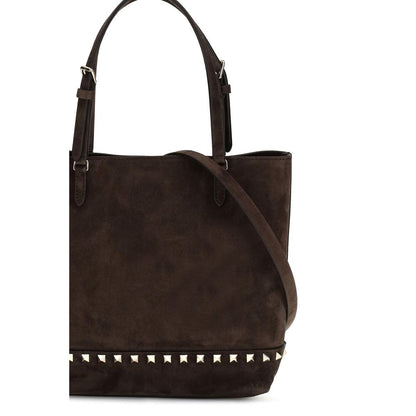 Small Shoulder Tote Bag by Valentino Garavani for women in bos taurus suede calf leather brown & signature features a enviable silhouette, showcasing a secure magnetic, ample , and enviable shoulder-strap, handle & adjustable-strap for a enviable finish.