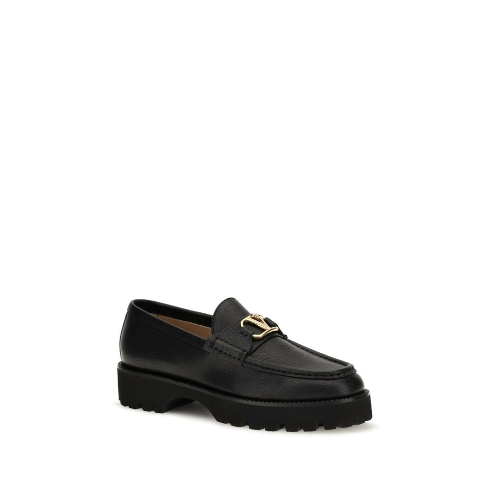 Platform Loafer Shoes by Valentino Garavani for women in bos taurus calf leather black & signature features an effortless chic silhouette, showcasing the V Logo Women's Bos Taurus Calf Leather Platform Loafer Shoes design with an effortless chic platform and a for a effortless chic look.