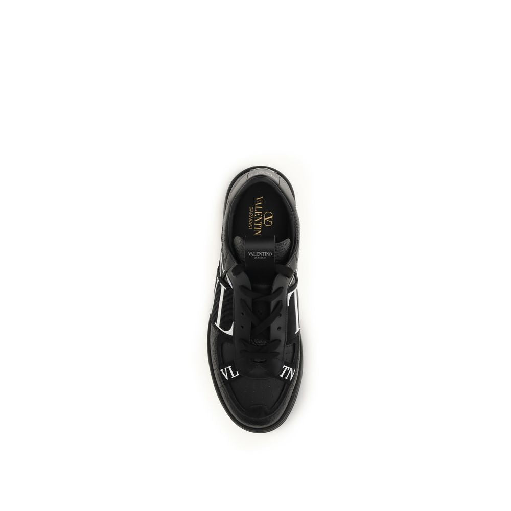 Athletic Sneakers by Valentino Garavani for men in bos taurus calfskin leather black features an timeless silhouette from the Men's Low Top Bos Taurus Calfskin Leather Athletic Sneakers collection, showcasing a timeless low-top style for a timeless look.