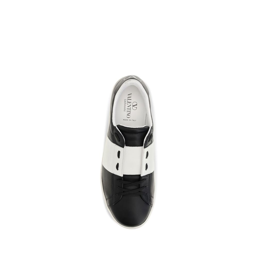 Sneakers by Valentino Garavani for men in bos taurus calf leather black presents a sumptuous silhouette, artfully capturing the essence of the Men's Slip On Bos Taurus Calf Leather Sneakers with its sumptuous slip-on style design.
