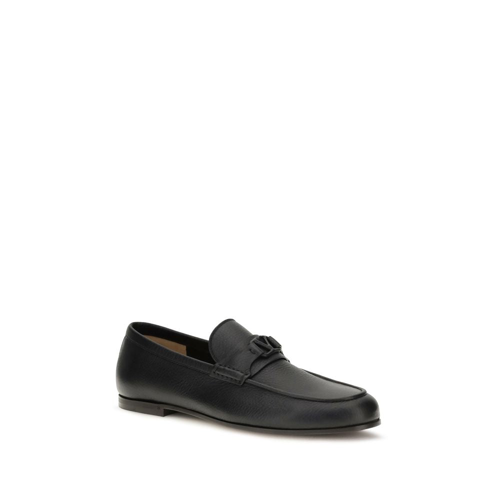 This Loafer Slip-On Shoes by Valentino Garavani for men in leather black & signature features an exquisite silhouette from the V Logo Men's Leather Loafer Slip-On Shoes collection, defined by a sophisticated and elegant .