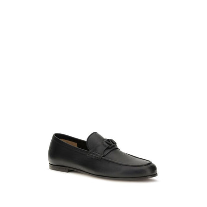 This Loafer Slip-On Shoes by Valentino Garavani for men in leather black & signature features an exquisite silhouette from the V Logo Men's Leather Loafer Slip-On Shoes collection, defined by a sophisticated and elegant .