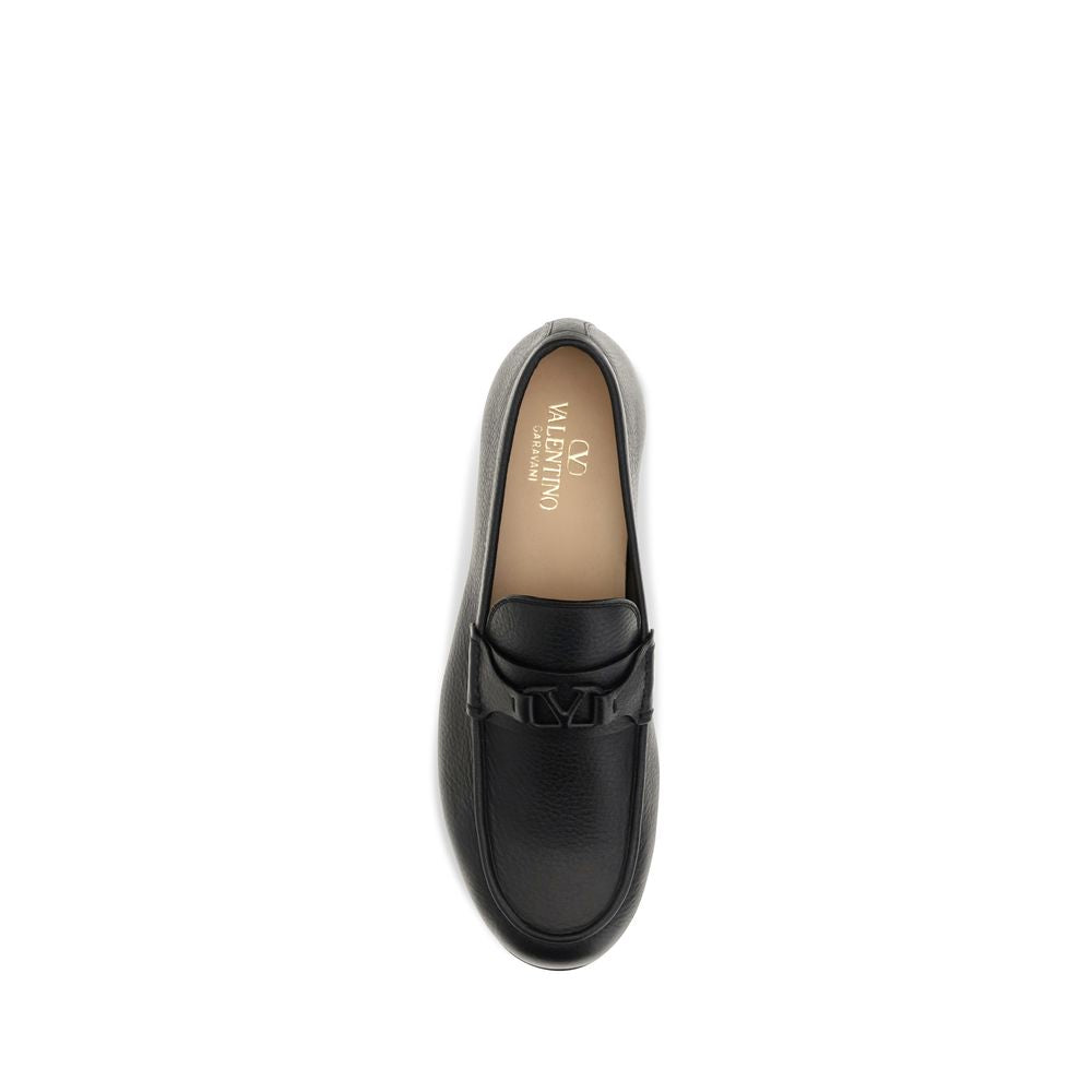 Loafer Slip-On Shoes by Valentino Garavani for men in leather black & signature features an effortless chic silhouette, showcasing the V Logo Men's Leather Loafer Slip-On Shoes design with an effortless chic and a for a effortless chic look.