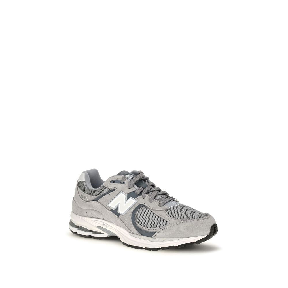 Athletic Sneakers by New Balance for men in polyester & rubber gray, signature & monogram features an effortless chic silhouette, showcasing the signature athletic style of the Men's Athletic Polyester & Rubber Sneakers collection with a truly effortless chic finish.