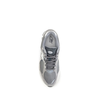 Athletic Sneakers by New Balance for men in polyester & rubber gray, signature & monogram showcases a architectural silhouette, artfully capturing the essence of the Men's Athletic Polyester & Rubber Sneakers with its signature architectural athletic style construction.