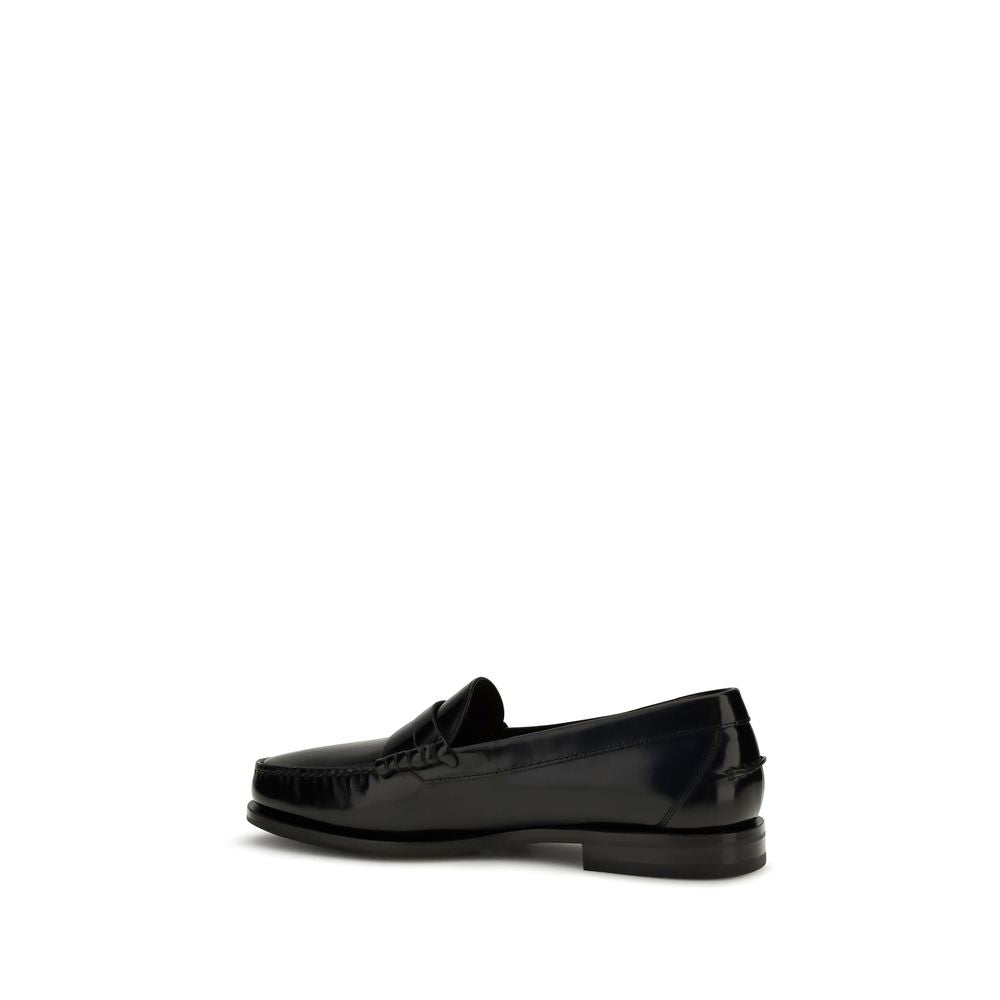 Loafer Slip-On Shoes by Santoni for men in bos taurus calf patent leather black features an effortless chic silhouette, showcasing the College Men's Bos Taurus Calf Patent Leather Loafer Slip-On Shoes design with an effortless chic and a for a effortless chic look.