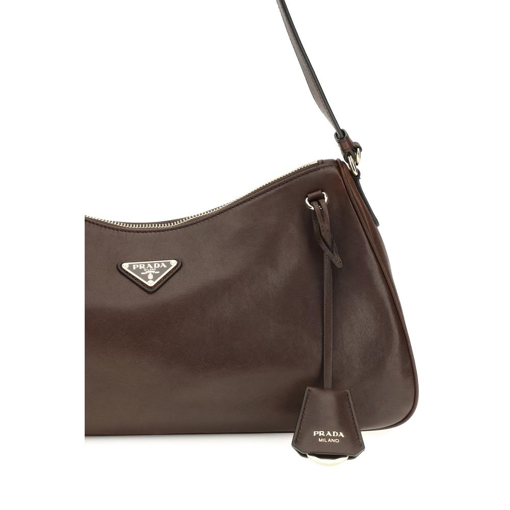 Shoulder Bag by Prada for women in bos taurus nappa leather brown & natural features a effortless sophistication silhouette, secured by a zipper with ample and versatile shoulder-strap for a effortless sophistication finish.