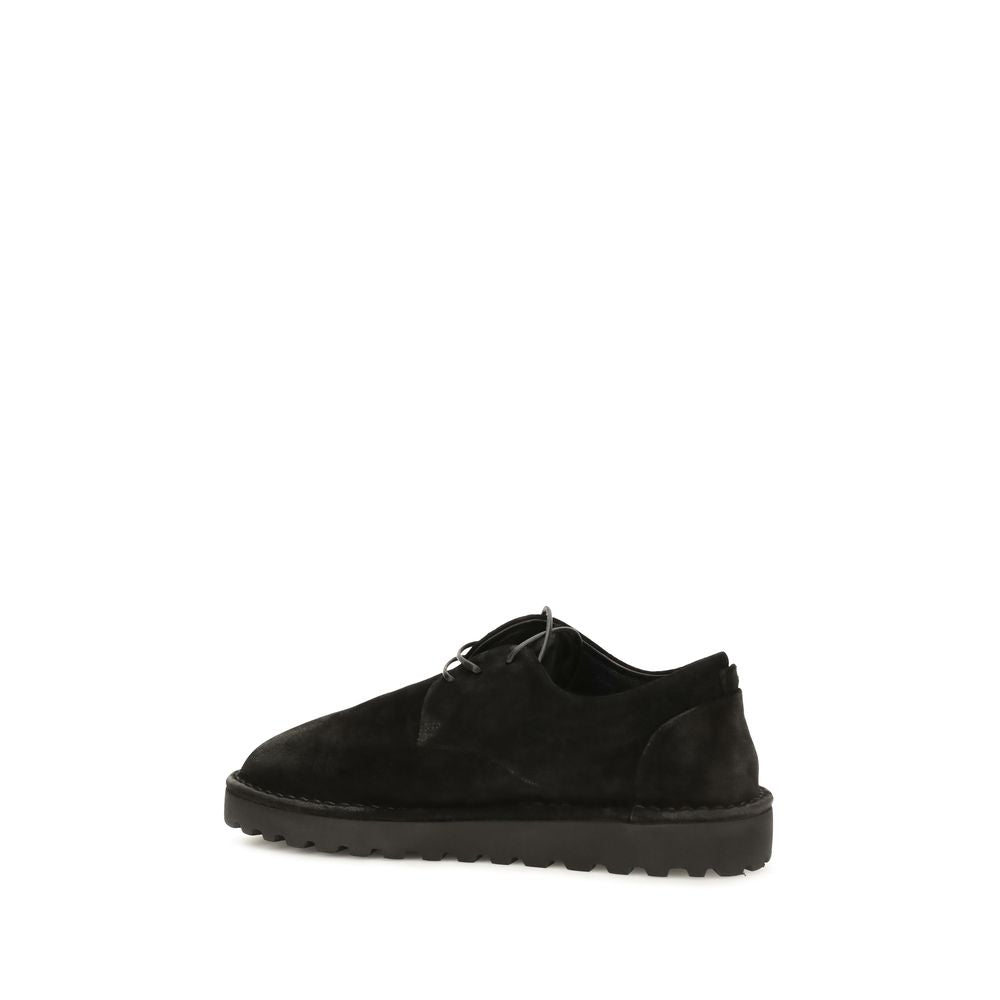This Derby Lace-Up Shoes by Marsell for men in bos taurus calf suede leather black features an exquisite silhouette from the Men's Bos Taurus Calf Suede Leather Derby Lace-Up Shoes collection, defined by a sophisticated and elegant round toe style.