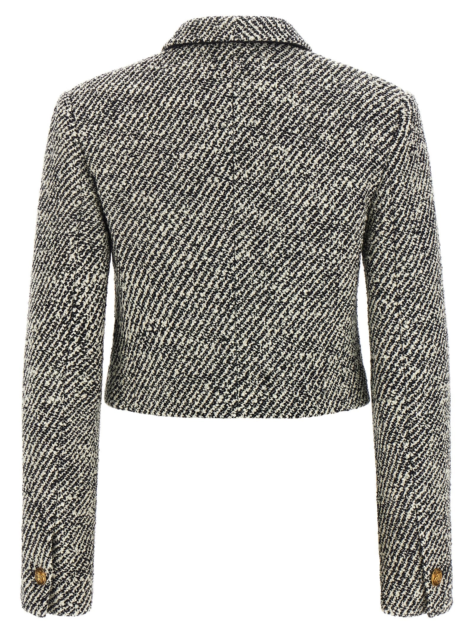 Overcoat by Versace for women in virgin wool & nylon bicolour, black, gold, white & patterned showcases a architectural silhouette, artfully detailed with a distinctive and functional for a architectural finish.