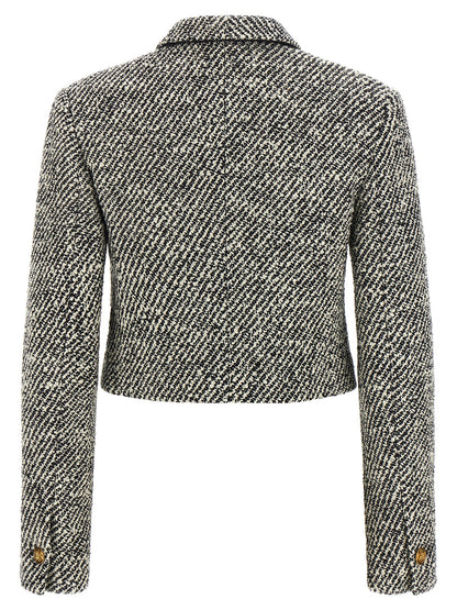 Overcoat by Versace for women in virgin wool & nylon bicolour, black, gold, white & patterned showcases a architectural silhouette, artfully detailed with a distinctive and functional for a architectural finish.