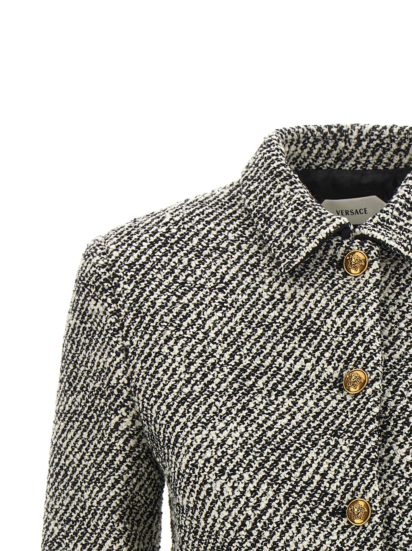 Overcoat by Versace for women in virgin wool & nylon bicolour, black, gold, white & patterned features an satoral silhouette, showcasing a sophisticated and satoral for a premium, timeless look.