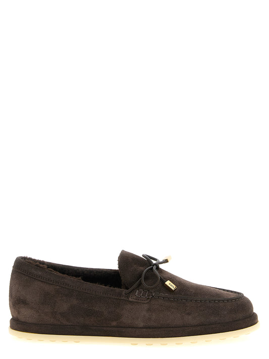 Flat Moccasin Moccasins Loafer Slip-On Winter Shoes by Tod's for women in calfskin leather brown & gold showcases a resplendent Women's Calfskin Leather Flat Moccasin Moccasins Loafer Slip-On Winter Shoes aesthetic, defined by its resplendent and elegant flat.
