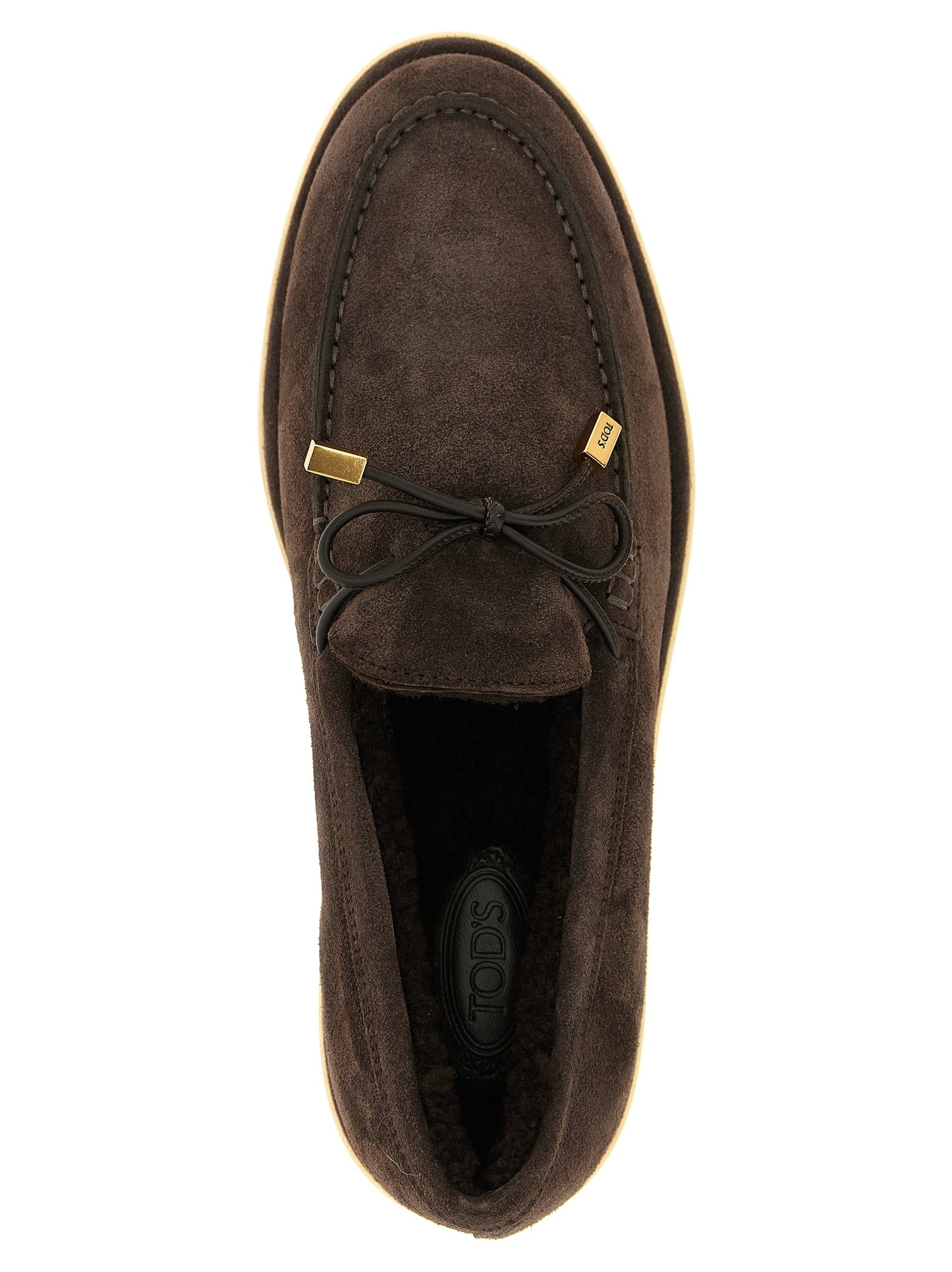 Flat Moccasin Moccasins Loafer Slip-On Winter Shoes by Tod's for women in calfskin leather brown & gold showcases a impeccable silhouette as Women's Calfskin Leather Flat Moccasin Moccasins Loafer Slip-On Winter Shoes, artfully designed with a impeccable flat and refined for a impeccable finish.