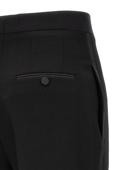Trousers by Tom Ford for women in satin wool black features an sartorial silhouette, showcasing a precise straight & slim and long with a sartorial high rise for a refined look.