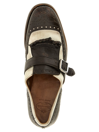 This Brogue Brogues Monk-Strap Strap Shoes by Church's for unisex in nubuck calfskin leather brown & silver features an exquisite silhouette from the Icon Unisex Nubuck Calfskin Leather Brogue Brogues Monk-Strap Strap Shoes collection, defined by a sophisticated and elegant .