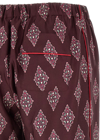Casual Pants by F.R.S. - FOR RESTLESS SLEEPERS for women in silk burgundy, multicolor, red & patterned presents a tailored silhouette, showcasing a tailored and long cut with a refined high rise for a truly tailored aesthetic.