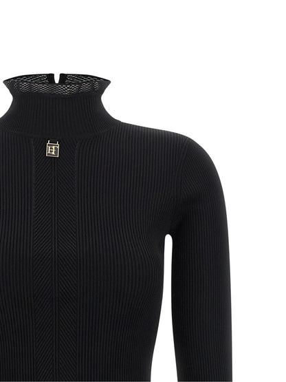 Dress by Elisabetta Franchi for women in polyamide & viscose black, gold & monogram features an magnificent silhouette, artfully detailed with a magnificent mock neckline and that flows into an magnificent midi.