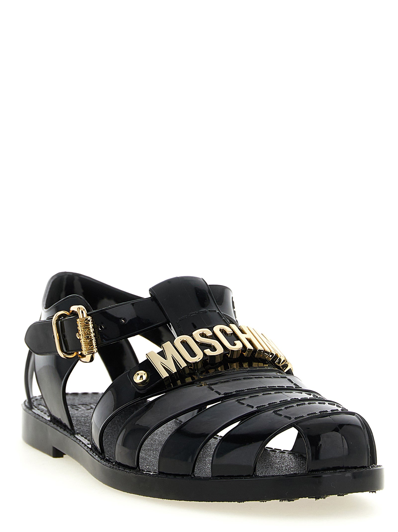 Flat Ankle Strap Cage Fisherman Sandals by Moschino for men in pvc black & gold features an exquisite silhouette, showcasing the exquisite Men's PVC Flat Ankle Strap Cage Fisherman Sandals with a flat and .