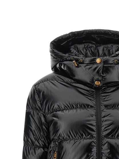 This Hooded Puffer Jacket by Moncler for women in polyamide & felt black & gold exhibits a edgy silhouette, meticulously detailed with functional hooded & insulated and a edgy hooded high-neck neckline for a edgy finish.