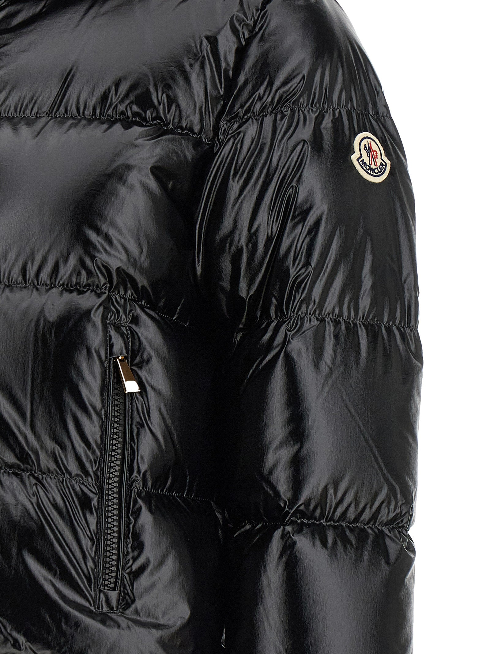 Hooded Puffer Jacket by Moncler for women in polyamide & felt black & gold presents a effortlessly chic silhouette, showcasing a sophisticated and premium hooded & insulated for a truly effortlessly chic finish.