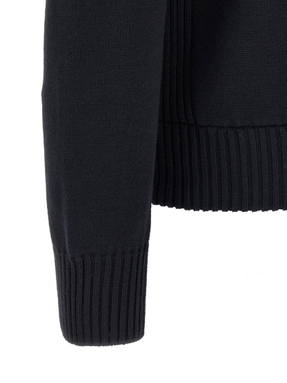 Cardigan by Moncler for men in virgin wool & polyester navy showcases a luxurious silhouette, meticulously detailed with a sophisticated high-neck neckline and for a refined finish.