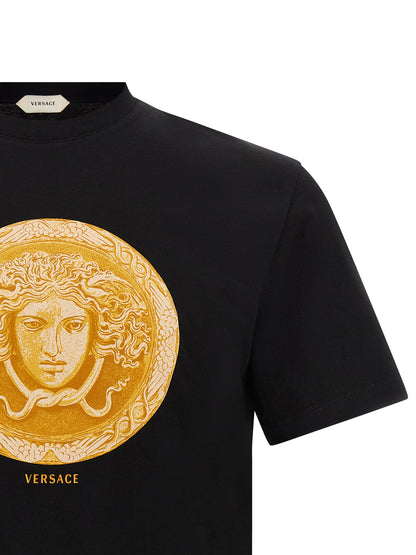 T-Shirt by Versace for men in cotton black, gold & print features an edgy silhouette, meticulously detailed with a sophisticated and round neckline for a truly edgy finish.
