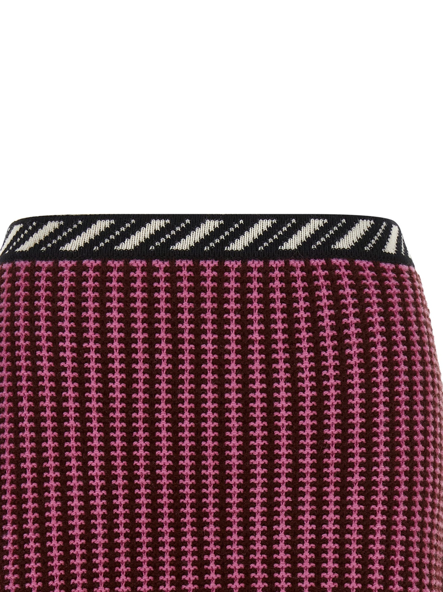 Skirt by Versace for women in virgin wool black, burgundy, cream, gold, multicolor, pink, patterned, signature & striped showcases a sultry silhouette, elegantly defined by its mini long and the sophisticated sultry design of the Crochet Medusa Women's Virgin Wool Mini Long Skirt.