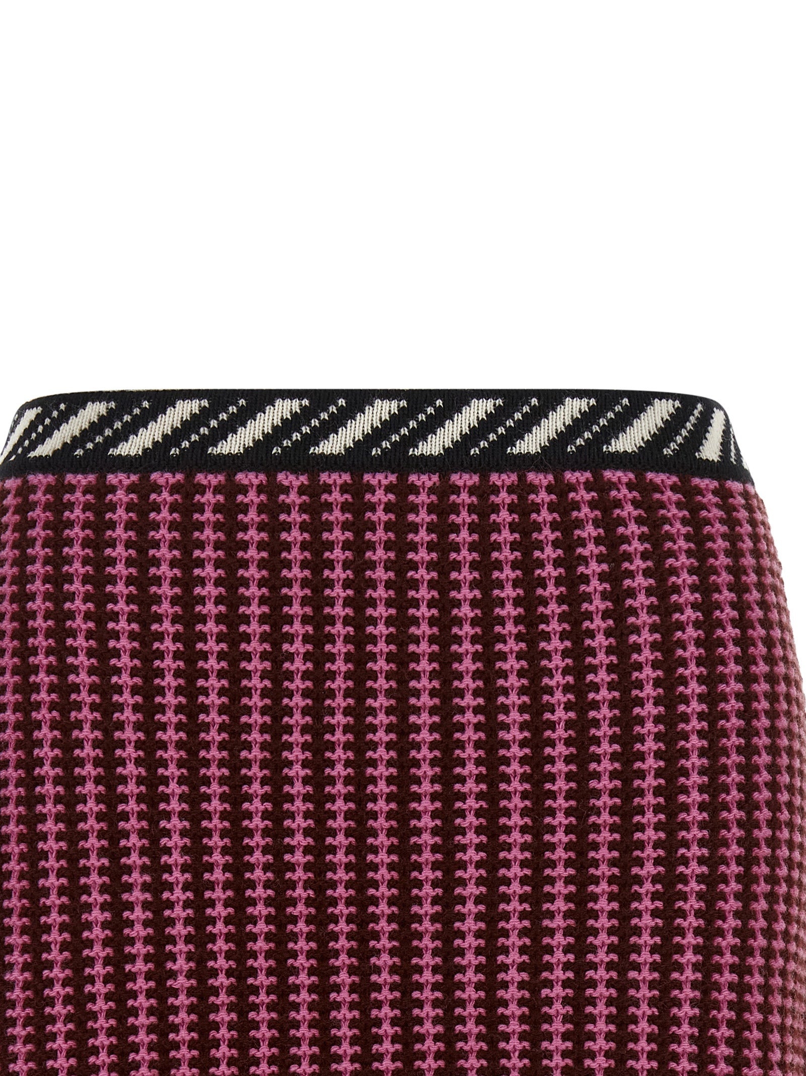 Skirt by Versace for women in virgin wool black, burgundy, cream, gold, multicolor, pink, patterned, signature & striped showcases a sultry silhouette, elegantly defined by its mini long and the sophisticated sultry design of the Crochet Medusa Women's Virgin Wool Mini Long Skirt.