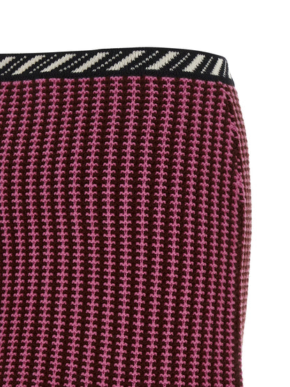 Skirt by Versace for women in virgin wool black, burgundy, cream, gold, multicolor, pink, patterned, signature & striped features a captivating silhouette, showcasing the captivating Crochet Medusa Women's Virgin Wool Mini Long Skirt design with a sophisticated mini long for a captivating look.