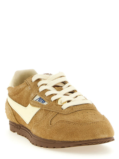 Athletic Sneakers by Autry for women in nylon & cowhide suede leather brown & signature showcases an impeccable silhouette, defined by an impeccable low-top style design that perfectly captures the essence of the Women's Low Top Nylon & Cowhide Suede Leather Athletic Sneakers.