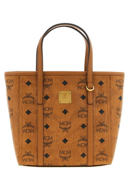 Small Shopper Tote Bag by MCM for women in polyester polyethylene polyurethane leather brown, gold, signature & monogram features an utilitarian-chic silhouette, showcasing the Visetos Polyester Polyethylene Polyurethane Leather Small Shopper Tote Bag design with a secure zipper, ample , and versatile shoulder-strap, handle & adjustable-strap.