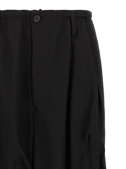 Casual Pants by Yohji Yamamoto for men in wool black features a refined silhouette with a refined wide, defined by a and a refined long for a refined finish.