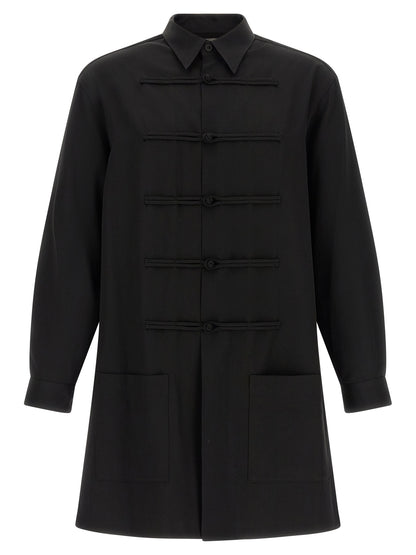 Shirt by Yohji Yamamoto for men in wool black presents a discerning silhouette, showcasing a sophisticated and for a truly discerning finish.