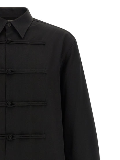 Shirt by Yohji Yamamoto for men in wool black showcases a sharp silhouette, elegantly detailed with a sharp and sharp .