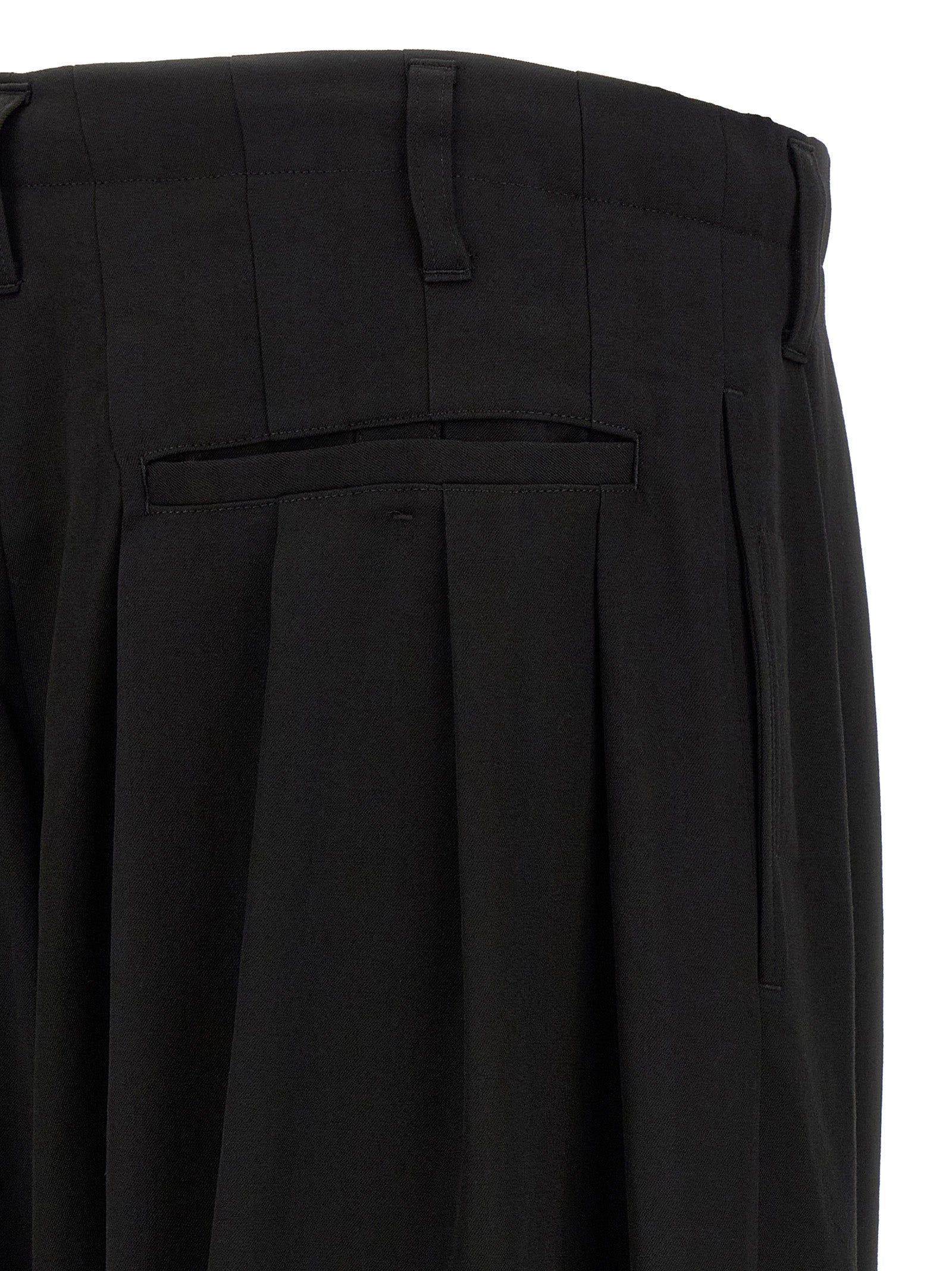 Trousers by Yohji Yamamoto for men in wool black features a artisanal silhouette, showcasing a sophisticated wide with a long and for a artisanal finish.