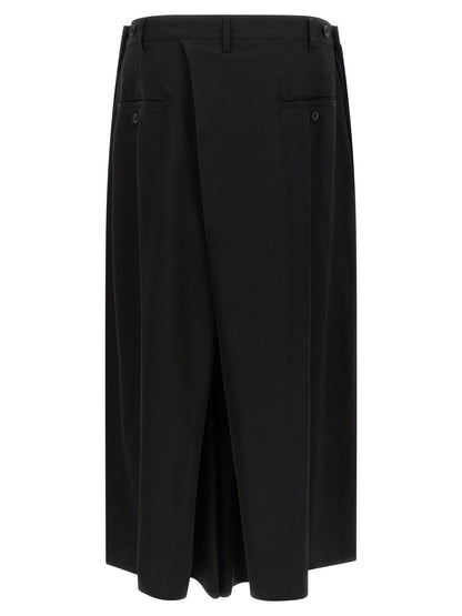 Trousers by Yohji Yamamoto for men in wool black features a artisanal silhouette, showcasing a sophisticated wide with a long and for a artisanal finish.