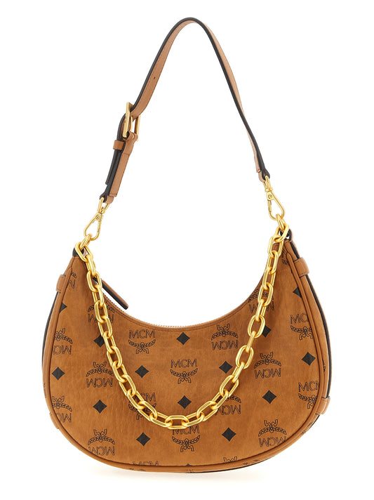 Mini Evening Crescent Shoulder Bag by MCM for women in poly cotton canvas brown & monogram features a enviable silhouette, showcasing a secure zipper, ample , and enviable shoulder-strap, adjustable-strap & handle for a enviable finish.