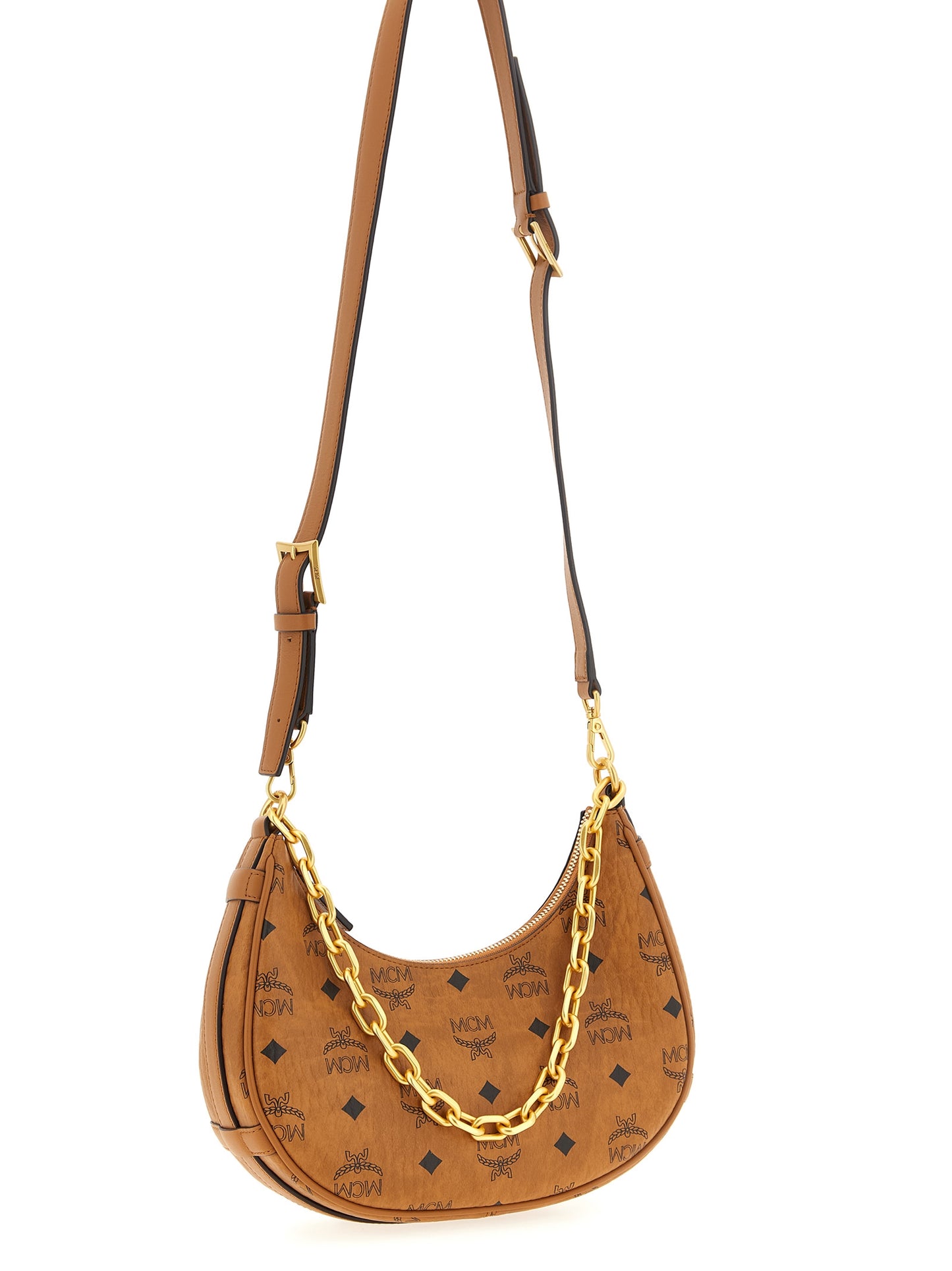 Mini Evening Crescent Shoulder Bag by MCM for women in poly cotton canvas brown & monogram presents a versatile silhouette, showcasing a secure zipper and versatile with versatile shoulder-strap, adjustable-strap & handle for a sophisticated look.