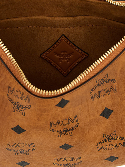 Mini Evening Crescent Shoulder Bag by MCM for women in poly cotton canvas brown & monogram features a effortless sophistication silhouette, secured by a zipper with ample and versatile shoulder-strap, adjustable-strap & handle for a effortless sophistication finish.