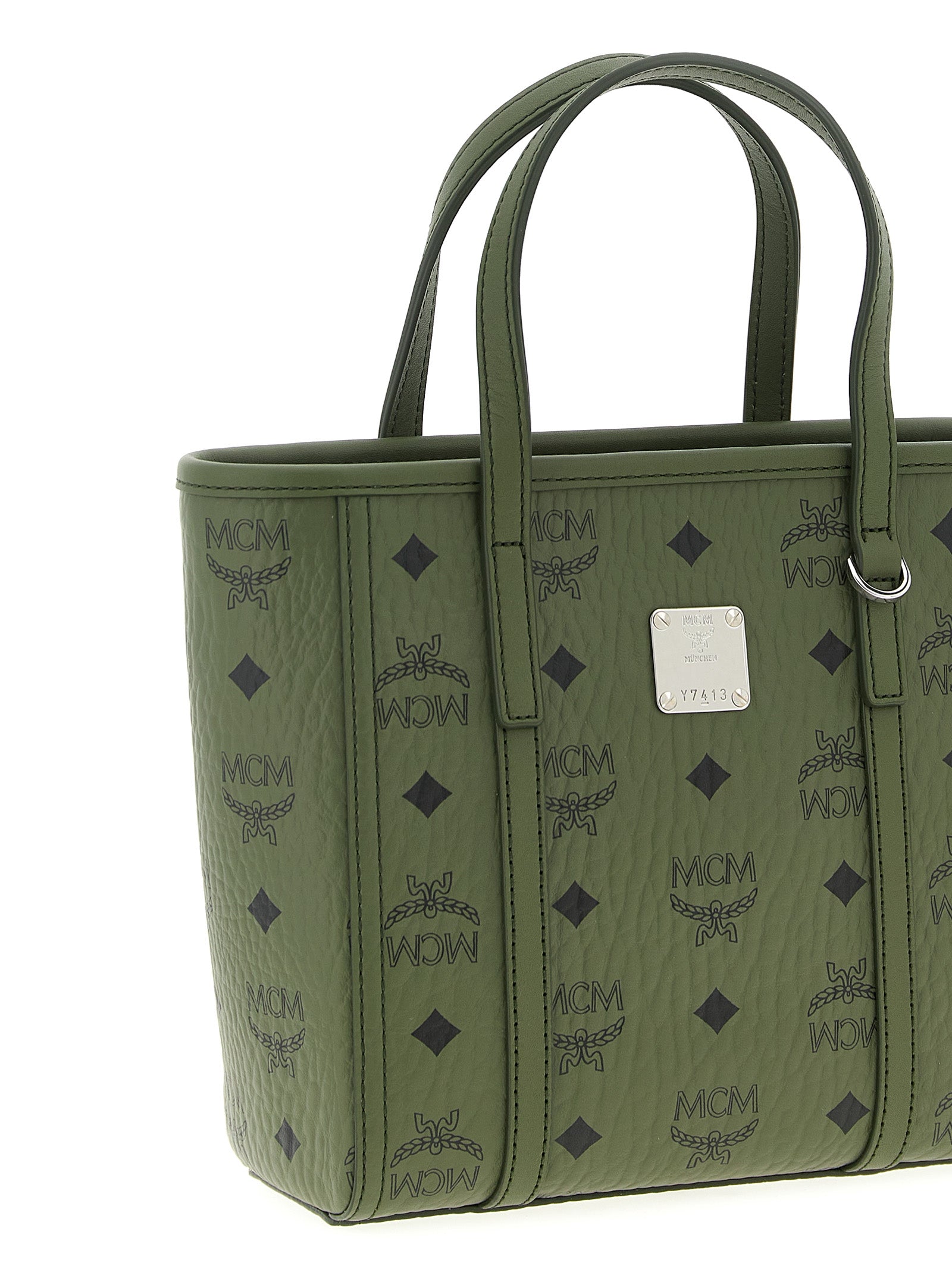 This Mini Shopper Tote Bag by MCM for women in poly cotton canvas bicolour, green & monogram features an on trend Icon Visetos Poly Cotton Canvas Mini Shopper Tote Bag design with a secure zipper, ample , and on trend shoulder-strap, adjustable-strap & handle.