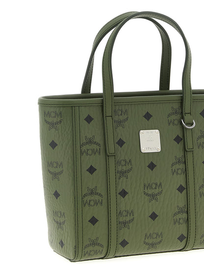 This Mini Shopper Tote Bag by MCM for women in poly cotton canvas bicolour, green & monogram features an on trend Icon Visetos Poly Cotton Canvas Mini Shopper Tote Bag design with a secure zipper, ample , and on trend shoulder-strap, adjustable-strap & handle.