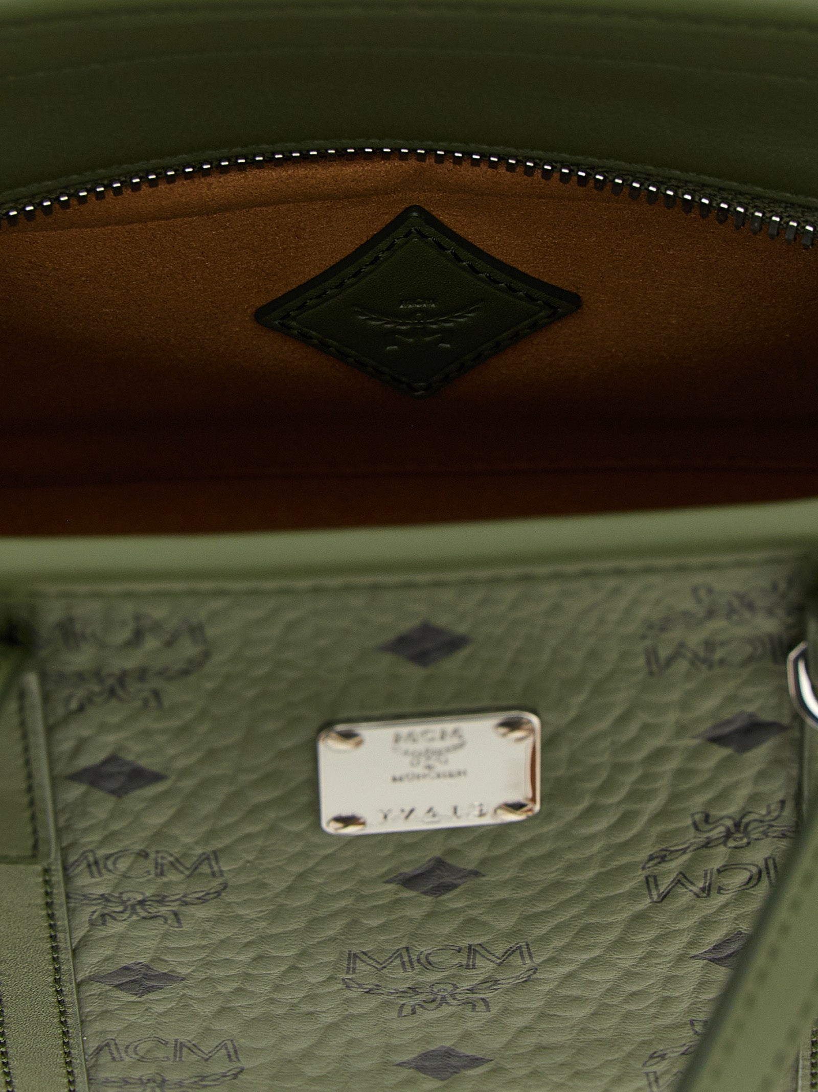 Mini Shopper Tote Bag by MCM for women in poly cotton canvas bicolour, green & monogram features an utilitarian-chic silhouette, showcasing the Icon Visetos Poly Cotton Canvas Mini Shopper Tote Bag design with a secure zipper, ample , and versatile shoulder-strap, adjustable-strap & handle.