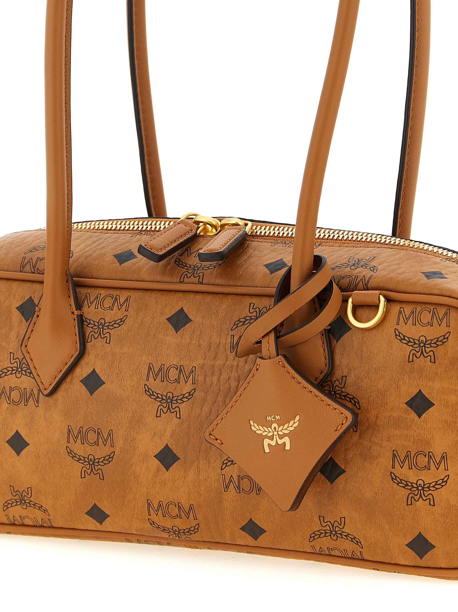 East West Shoulder Bag by MCM for women in suede polyester polyethylene polyurethane leather brown & natural features a enviable silhouette, showcasing a secure zipper, ample , and enviable shoulder-strap for a enviable finish.