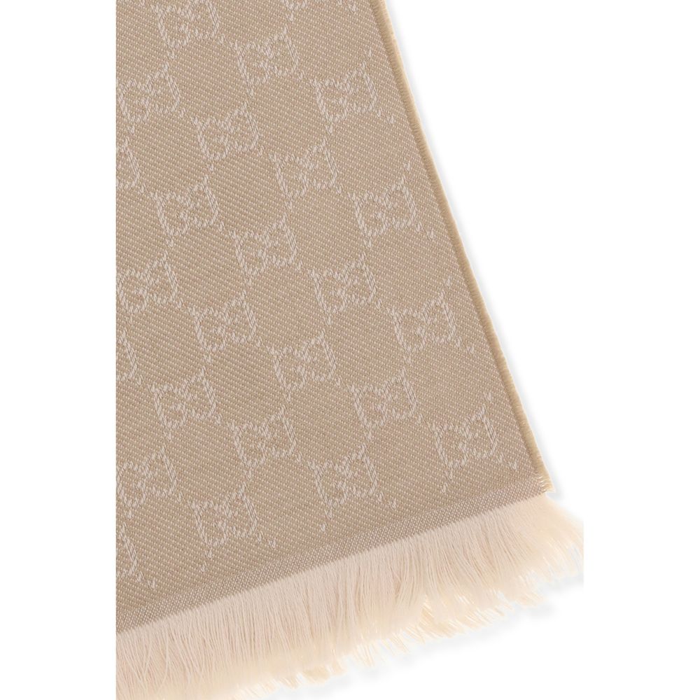 Scarf by Gucci for women in wool beige features a snug silhouette, perfectly showcasing the elegant drape and premium finish of the Gg Wool Foulard Frayed-Edge Scarf.