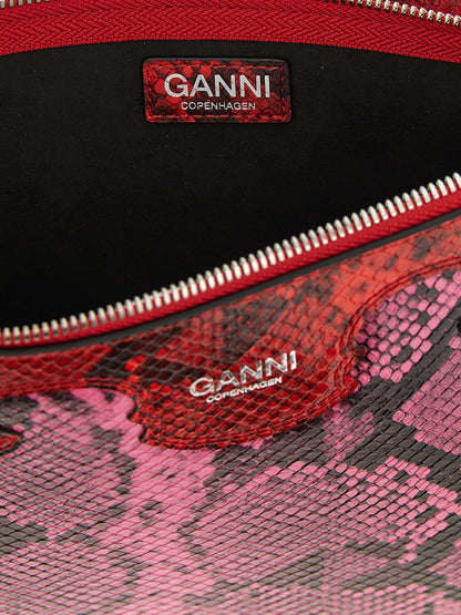 Pouch Clutch Handbag by Ganni for women in polyester & polyurethane fuchsia & print showcases a sculptural silhouette, featuring a secure snap, zipper & hook, ample , and versatile for a sculptural aesthetic.