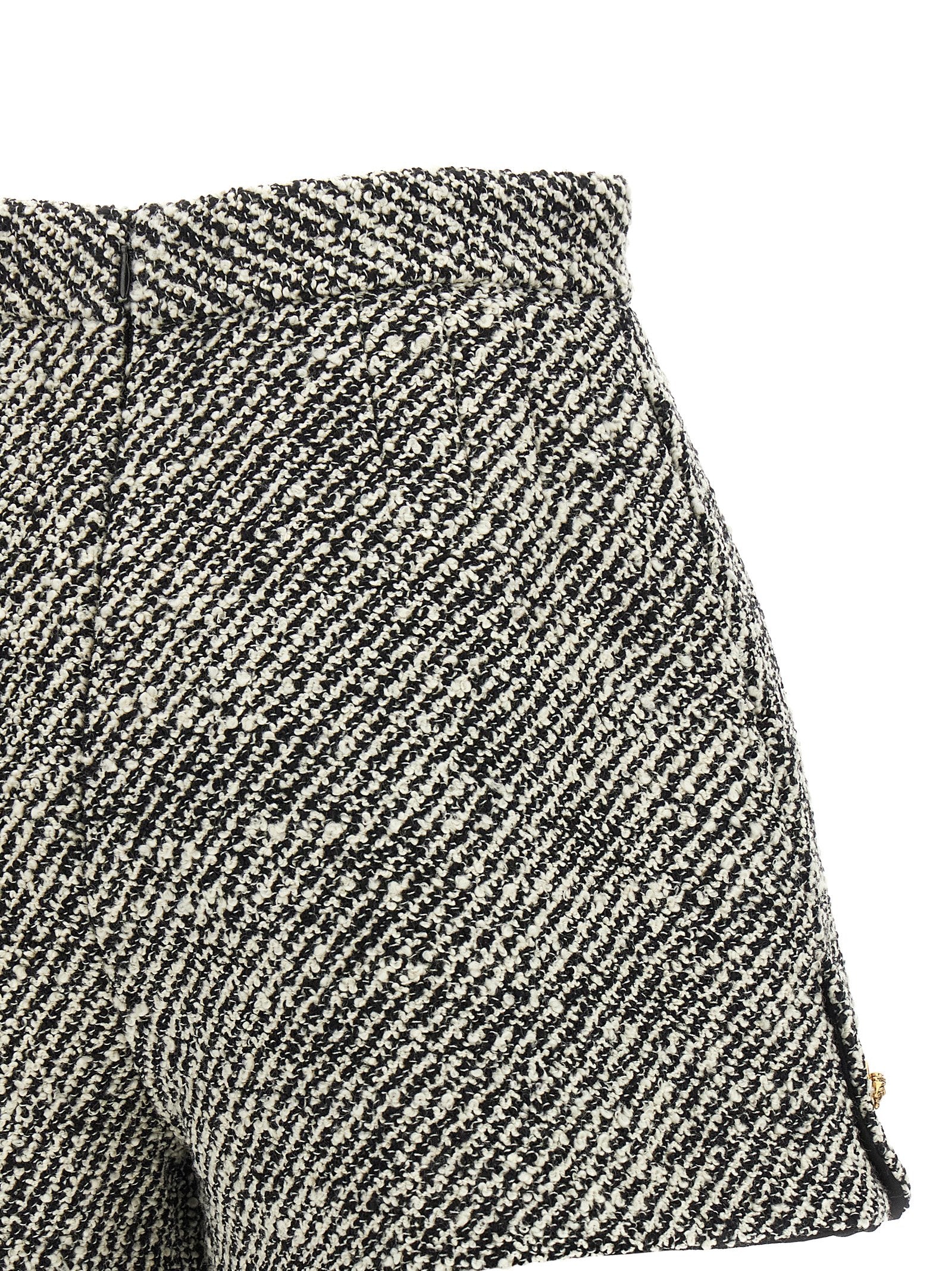 Bermuda Shorts by Versace for women in virgin wool & nylon bicolour, black, gold, white, patterned & signature features a sartorial silhouette, showcasing a sartorial and short with a sophisticated high rise for a sartorial look.