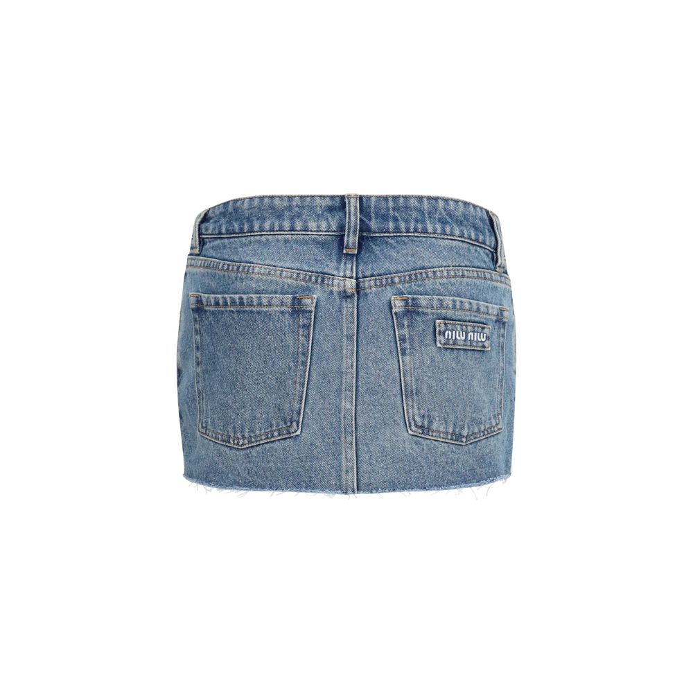 Skirt by Miu Miu for women in denim cotton blue features a contoured silhouette from the Women's Denim Straight Cotton Mini Skirt collection, characterized by its contoured mini for a contoured finish.