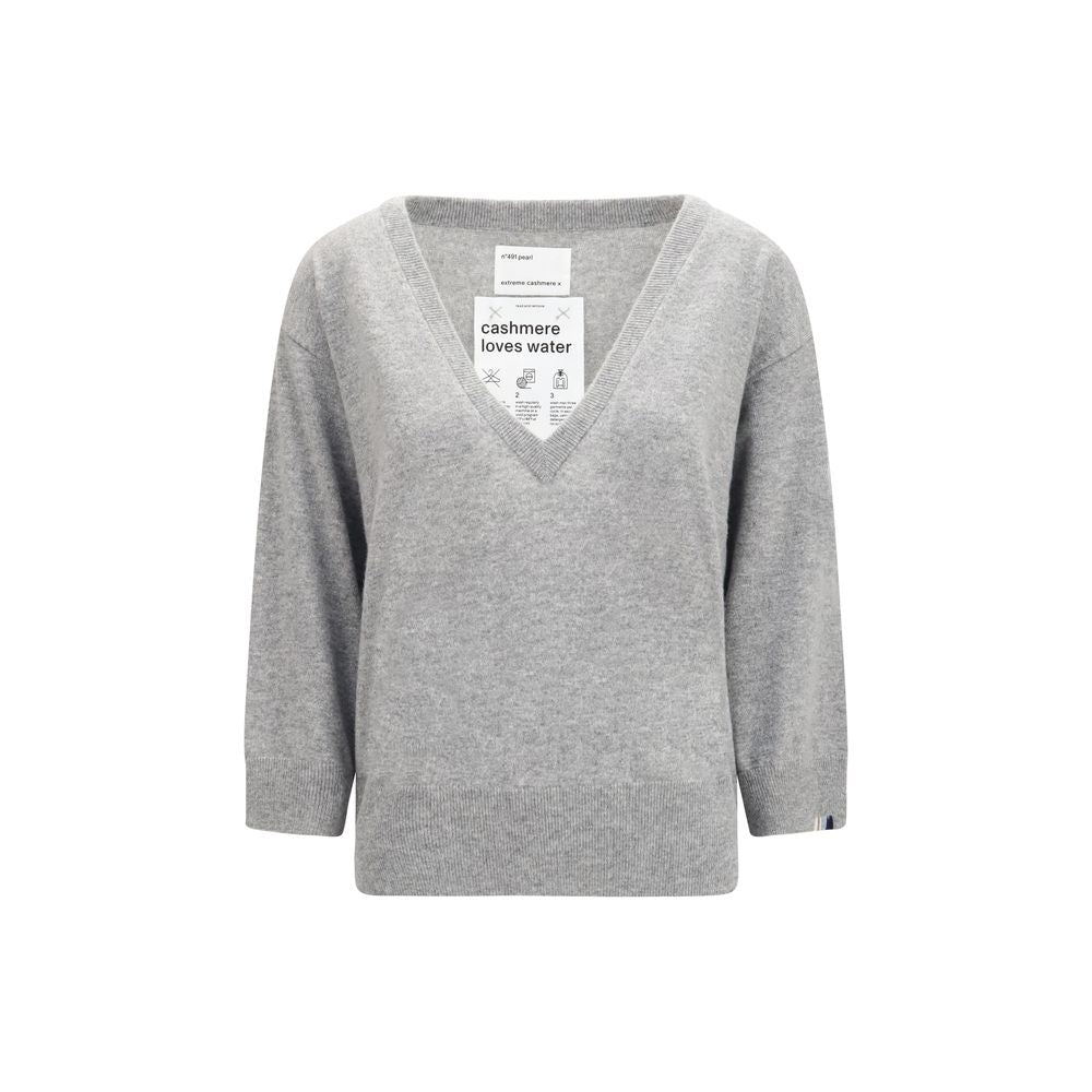Sweater by Extreme Cashmere for women in cashmere & capra leather gray showcases a downtown chic silhouette, artfully finished with a downtown chic v-neck neckline and short-sleeve for a sophisticated, high-end look.