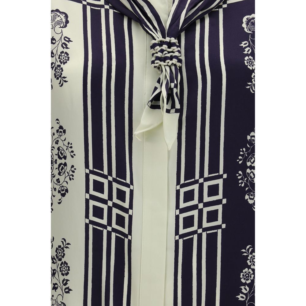 Shirt by Alemais for women in silk satin blue, floral, print & striped features an architectural silhouette with a refined and elegant for a architectural look.